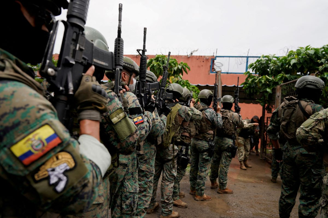 Soldiers get ready to enter cell block 3 at the militarized Litoral prison, as part of the measures taken by Ecuador's President Daniel Noboa to crackdown on gangs, during a media tour in Guayaquil, Ecuador, February 9, 2024. REUTERS/Santiago Arcos