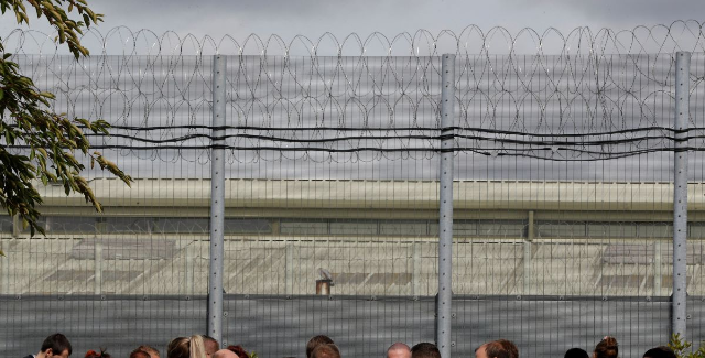 Prison officers stand outside Nottingham Prison, Britain September 14, 2018. REUTERS/Darren Staples