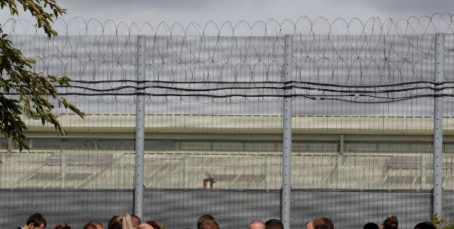 Prison officers stand outside Nottingham Prison, Britain September 14, 2018. REUTERS/Darren Staples