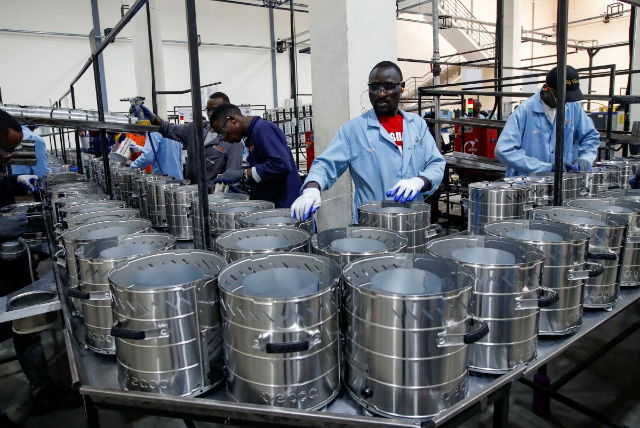 Workers assemble clean wood cookstoves at a factory in the Ruiru area of Kiambu County, Kenya, July 27, 2023. REUTERS/Monicah Mwangi