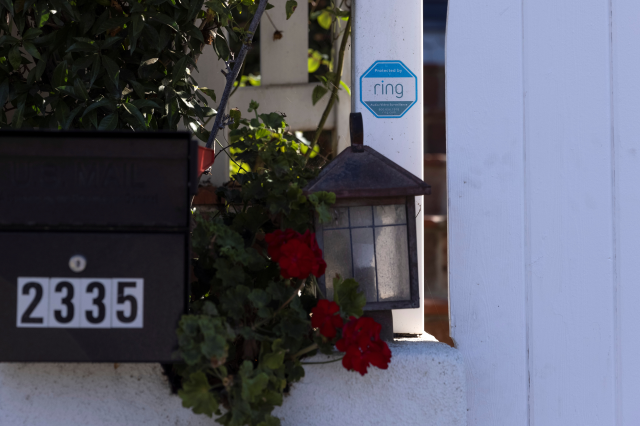 An Amazon Ring sign is shown as a security warning at the entrance to a residential home in Encinitas, California, U.S., September 30, 2021. REUTERS/Mike Blake