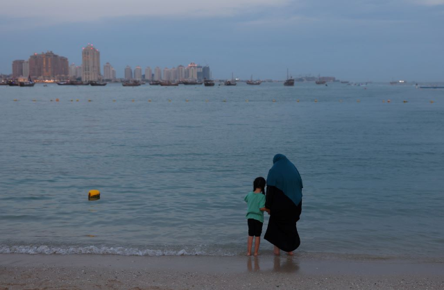 A woman and a child are seen at Katara Beach, Doha, Qatar, November 29, 2022