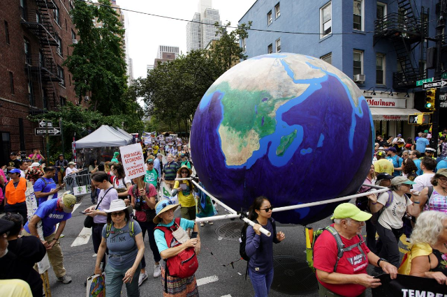 Activists mark the start of Climate Week in New York during a demonstration calling for the U.S. government to take action on climate change and reject the use of fossil fuels in New York City, New York, U.S., September 17, 2023. REUTERS/Eduardo Munoz