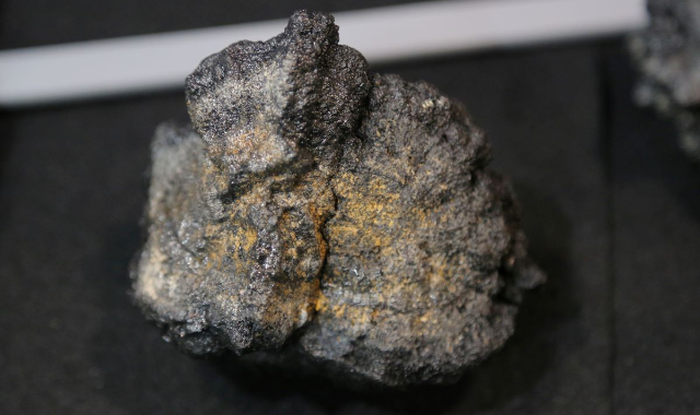 A polymetallic, or manganese, nodule is displayed the the booth of DeepGreen Resources, a seafloor mining startup, during the Prospectors and Developers Association of Canada (PDAC) annual convention in Toronto, Ontario, Canada March 4, 2019. REUTERS/Chris Helgren