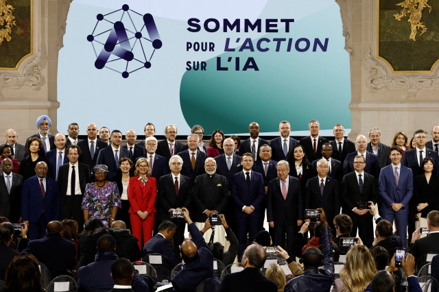 Heads of state and government and business leaders pose for a photo at the Artificial Intelligence (AI) Action Summit at the Grand Palais in Paris, France, February 11, 2025. REUTERS/Benoit Tessier