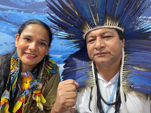 Indigenous Brazilians Shirley Djukurnã Krenak and Alberto Terena pose for a photo at the COP27 U.N. climate negotiations in Sharm el-Sheikh, Egypt, November 11, 2022. Thomson Reuters Foundation/Laurie Goering