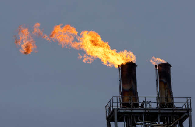 Flames blaze from a chimney at Western Europe's largest liquefied natural gas plant Hammerfest LNG in Hammerfest, Norway, March 14, 2024. REUTERS/Lisi Niesner