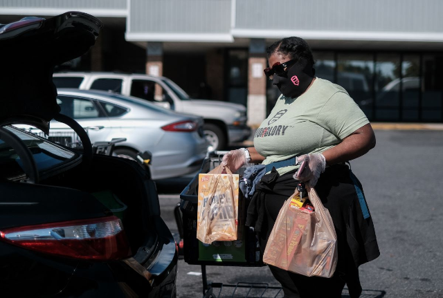 Tyrita Franklin-Corbett loads groceries into her car at a local grocery store as the spread of the coronavirus disease (COVID-19) continues, in District Heights, Maryland, October 6, 2020
