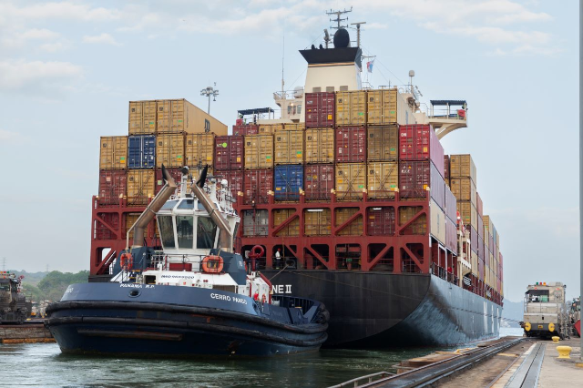 A container ship waits for water to fill at the Miraflores locks as it crosses through the Panama Canal, Panama. February 15, 2024. Thomson Reuters Foundation/Enea Lebrun.