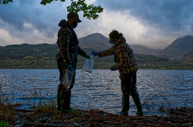Scientists from monitoring company NatureMetrics collect water to then capture traces of DNA to identify local wildlife species, in The Trossachs National Park, Scotland, October 20, 2021