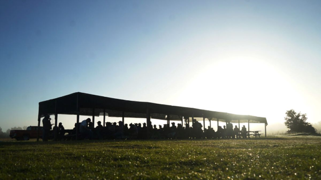 Workers carry out peer education on heat stress protections at a farm in the U.S. state of Georgia in December 2022. Fair Food Program/Handout via Thomson Reuters Foundation.